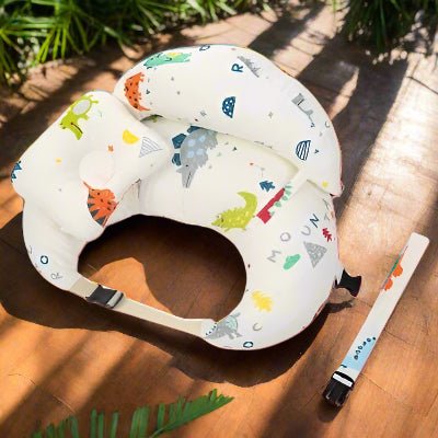Coussin d allaitement dinos colorés fond blanc