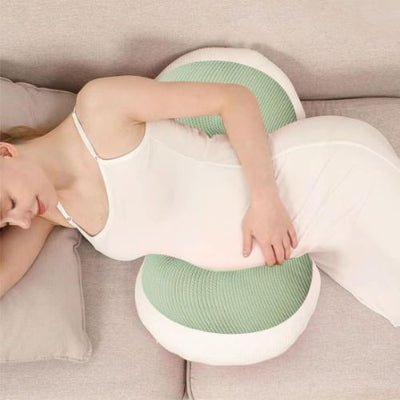 Coussin de grossesse vert maman couché sur côté