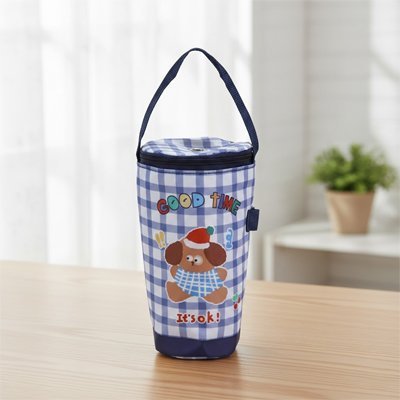 Porte biberon chien bleu sur table